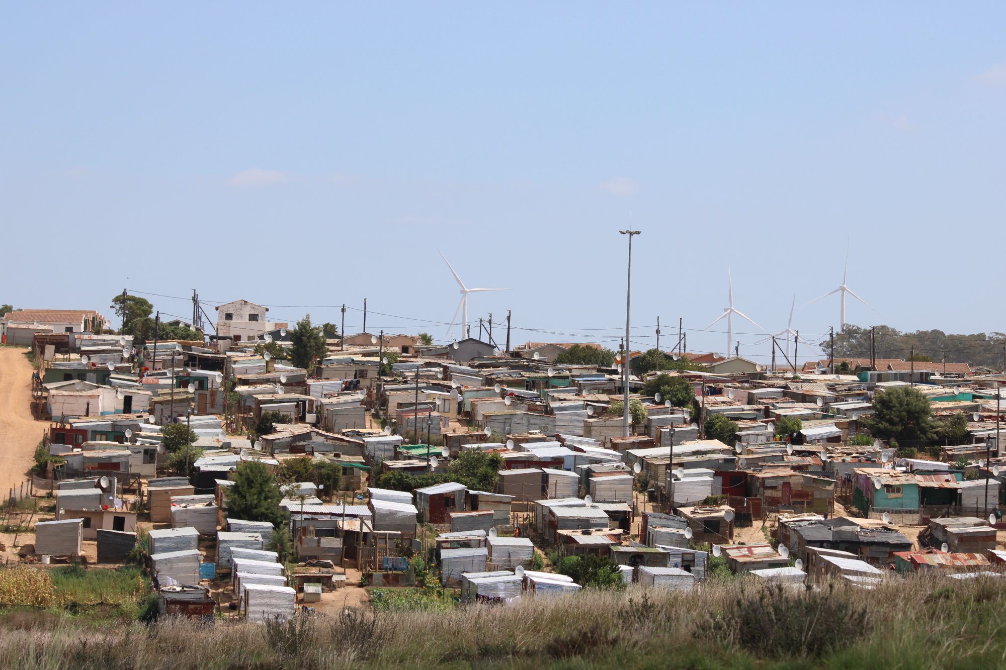 Informal settlement with wind turbines